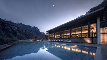 Indoor pool, outdoor pool, pool umbrellas, lifeguards on site