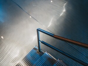 A metallic, perforated floor with a metal handrail. - VAYA Galtür Paznaun (Galtur)