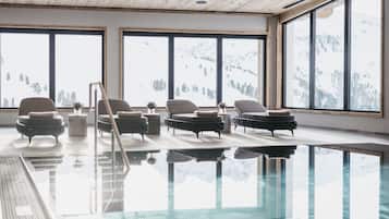 Indoor pool, open 7:00 AM to 7:00 PM, pool loungers
