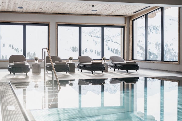 Indoor pool, open 7:00 AM to 7:00 PM, pool loungers