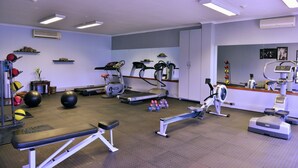 A gym with treadmills, stationary bikes, and various exercise equipment. - Riviera on Vaal Resort (Vereeniging)