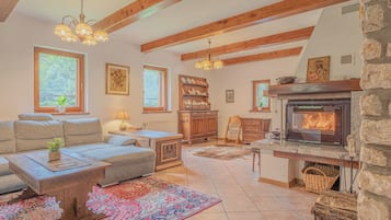 Family Chalet, Multiple Bedrooms, 2 Bathrooms, Mountainside (Chalet Primus Near Soča Gorge) | Living area | 21-inch TV with digital channels, fireplace, DVD player