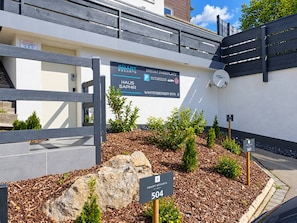 A sign for Smart Resorts with a private parking area, a mailbox, and a mailbox number 502.