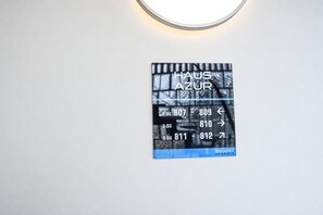 A digital display with room numbers and directional arrows, indicating room locations and directions.