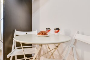 Superior Quadruple Room | Living area | Flat-screen TV - Travelto Poltavskaya 5 (St. Petersburg)