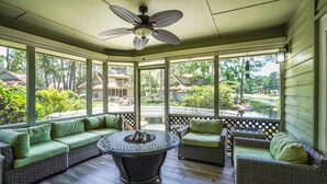 A covered porch with wicker furniture and a central fire pit. - Get Free Night/See Description*Golf Cart*Nearby Pool*Cart To Beach,Baytowne,Pool (Miramar Beach)