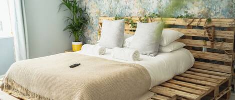 Grand Room | Premium bedding, blackout curtains, iron/ironing board, free WiFi