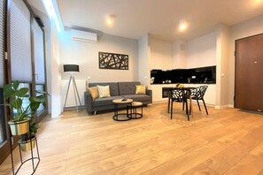 Premium Apartment, 1 Bedroom, Balcony, Garden View | Living area | 32-inch LED TV with cable channels, TV - erApartments Browary Warszawskie (Warsaw)