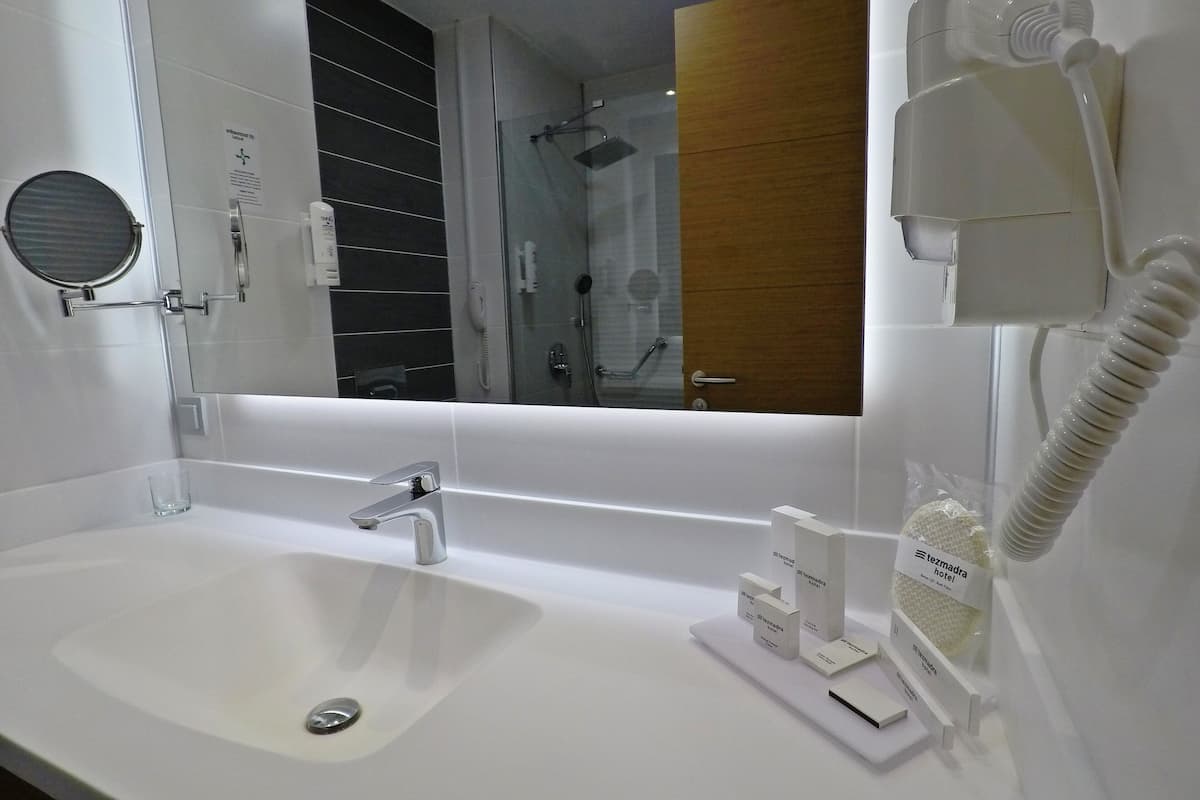 shower, rainfall showerhead, hair dryer, slippers