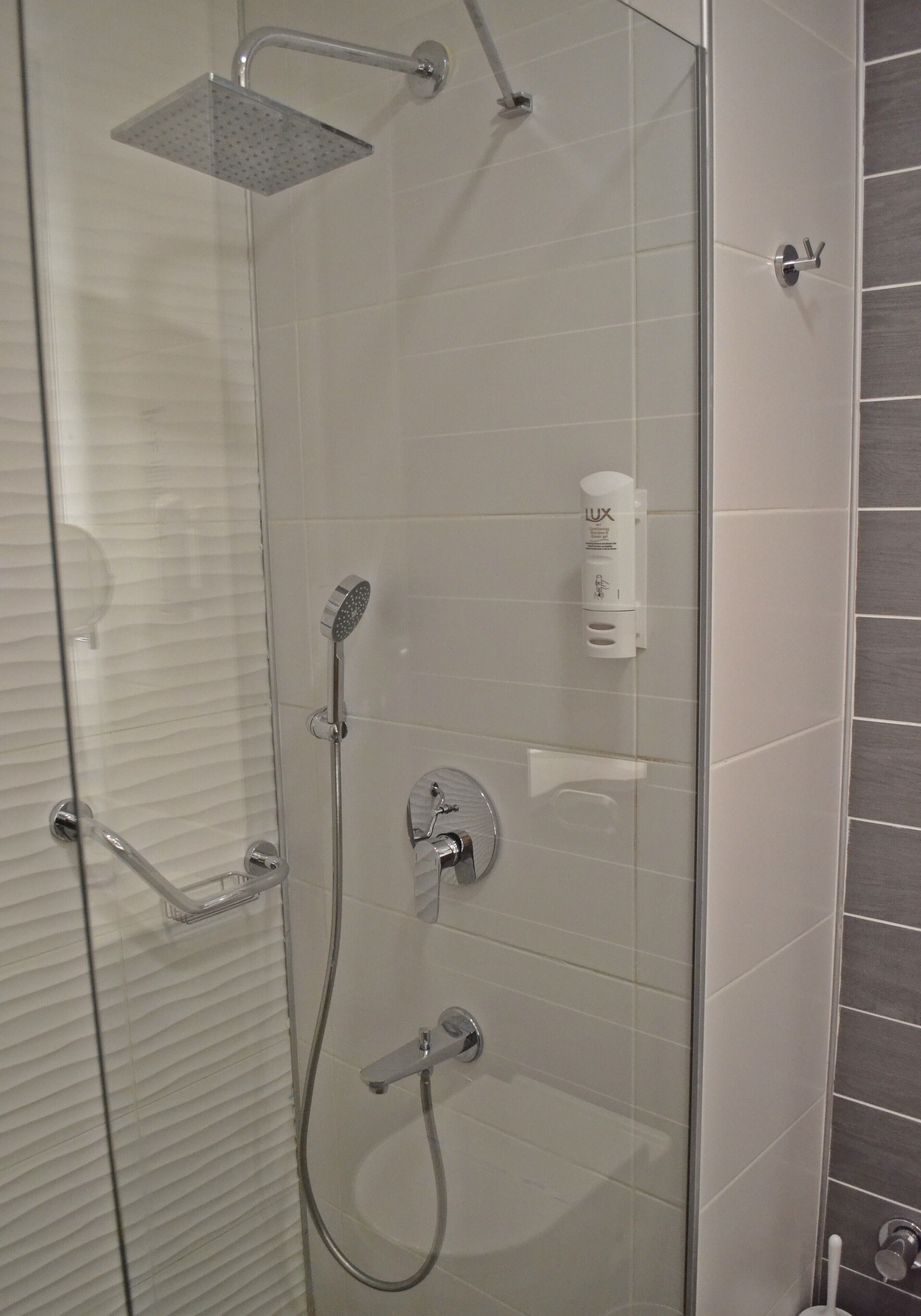 shower, rainfall showerhead, hair dryer, slippers