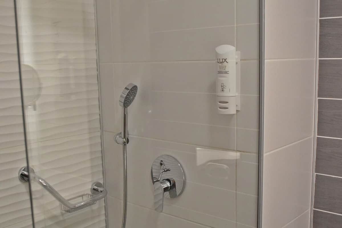 shower, rainfall showerhead, hair dryer, slippers