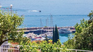 A marina with boats docked, a clear view of the water, and surrounding greenery. - Beautiful Home in Icici With Wifi and 3 Bedrooms (Opatija)