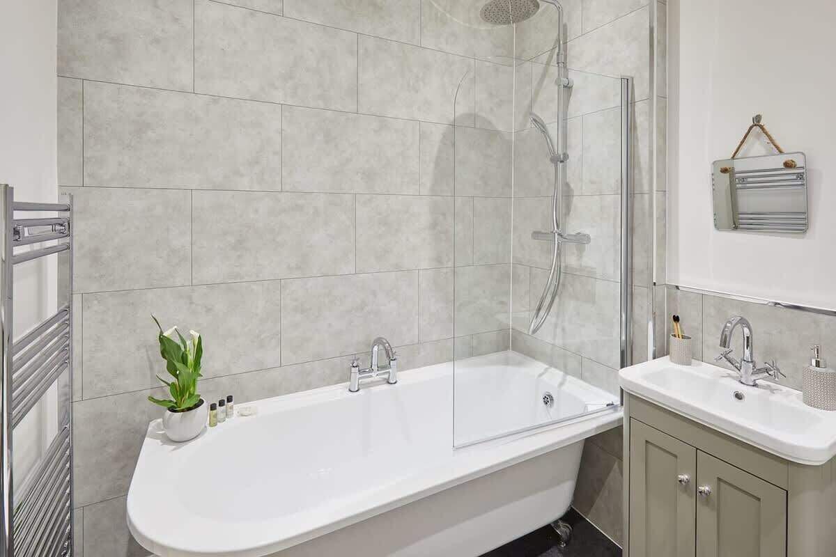 Bathtub, hair dryer, towels, soap
