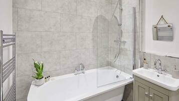 Bathtub, hair dryer, towels, soap