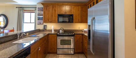 Condo, 2 Bedrooms | Private kitchen | Fridge, oven, coffee/tea maker, toaster