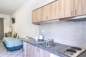 Standard Triple Studio | Private kitchen | Mini-fridge, electric kettle, cookware/dishes/utensils - Olga Villa (Skiathos)
