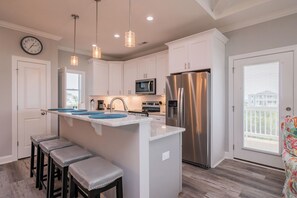 Fridge, microwave, oven, stovetop - Pappy's Place: Spacious, Modern Vacation Rental with Pool and Elevator (Oak Island)