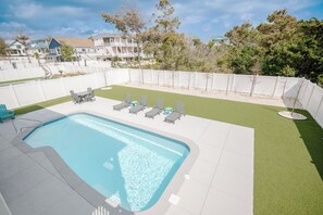 A heated pool - Pappy's Place: Spacious, Modern Vacation Rental with Pool and Elevator (Oak Island)