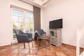 Condo | Living area | 50-inch flat-screen TV with satellite channels, TV - Das Backhaus 3 (Stoltebuell)