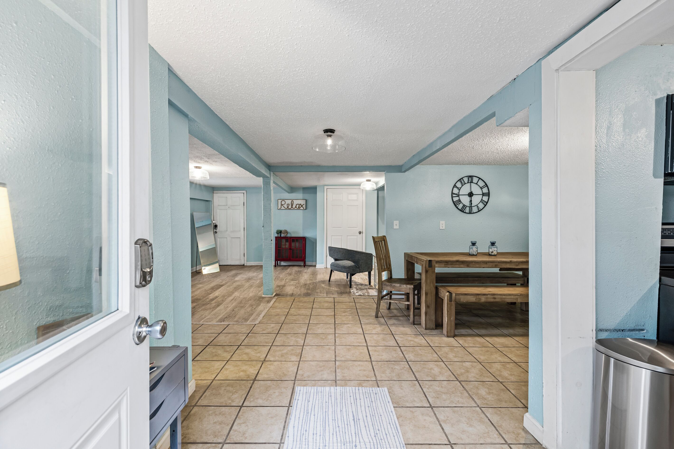 Step into Historic Anchor at M — an open studio with a living area, dining, and original hardwood floors.