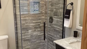 Combined shower/tub, hair dryer, towels, soap