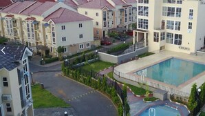 A residential area with a central swimming pool surrounded by apartment buildings. - Furnished 4 Beds Semi-det House in Abuja, Nigeria (Lagos)