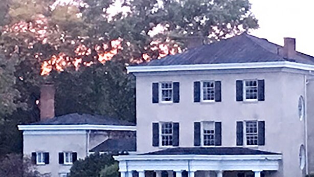 A large, two-story building with a symmetrical facade, featuring a central entrance with columns and a portico. - The Garden Suite in this National Historic Landmark in the Village of Geneseo (Geneseo)