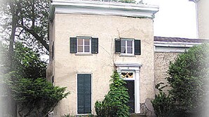 A two-story building with a pool in front. - The Garden Suite in this National Historic Landmark in the Village of Geneseo (Geneseo)