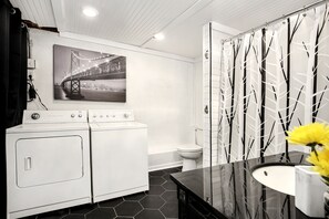 Combined shower/tub, hair dryer, towels, soap