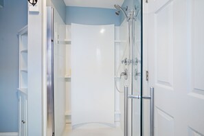 Shower, hair dryer, towels, toilet paper