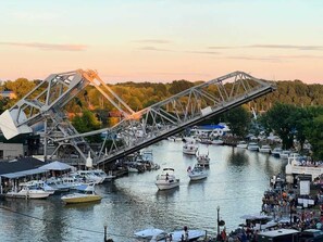 A river with boats and a bridge.