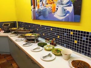 A buffet setup with various dishes and condiments. - Bethlehem B&B & Villa Kenting (Hengchun)