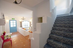 A staircase with patterned tiles leading to a landing. - Bethlehem B&B & Villa Kenting (Hengchun)