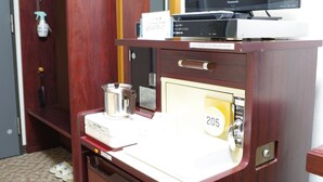 A wooden desk with a Panasonic TV, a small cabinet, and a number 205 sign. - City Hotel Seiunso (Sakai)