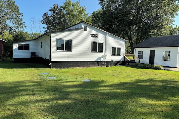 Front of house; deck wraps around the side and back of house.