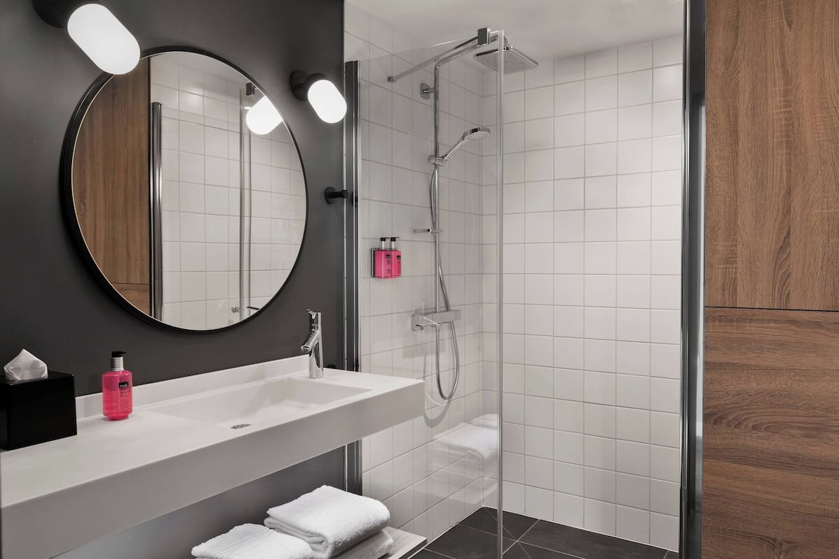 room, 1 queen bed with sofa bed | bathroom | shower, hair dryer, towels, soap