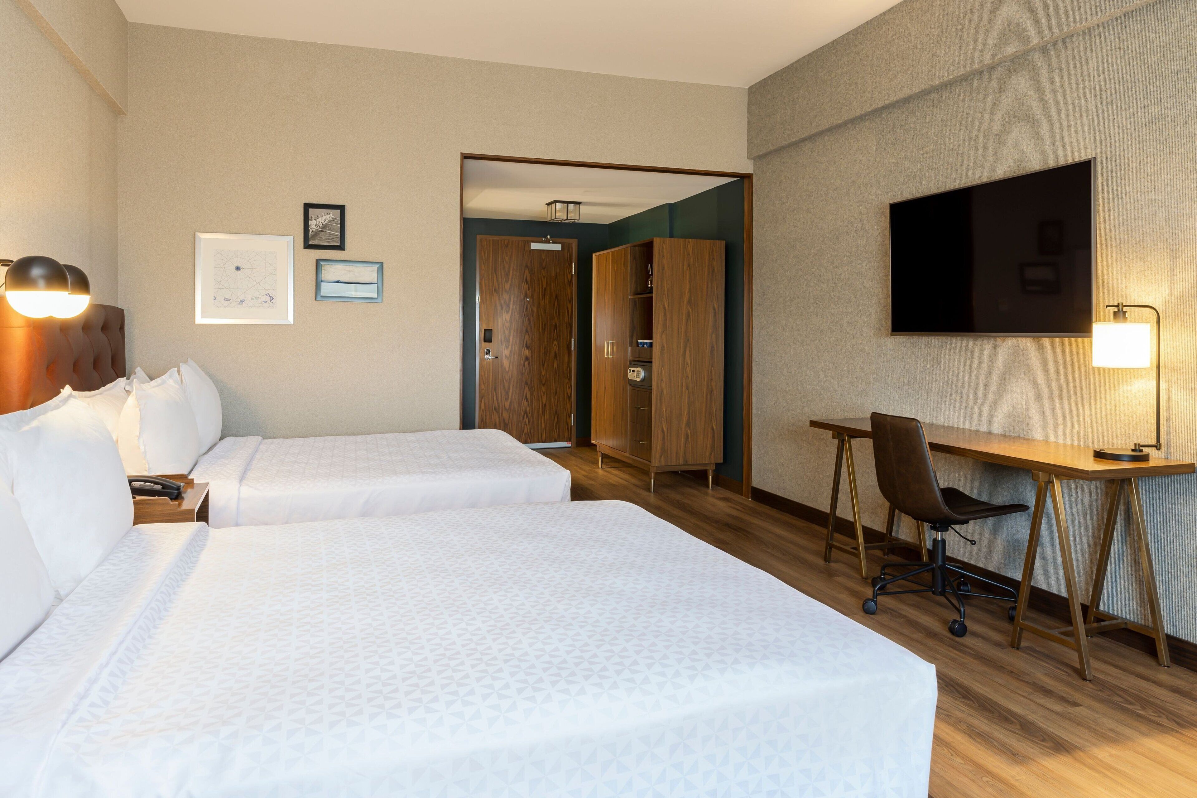 premium room, 2 queen beds, non smoking | in-room safe, desk, iron/ironing board, free cots/infant beds