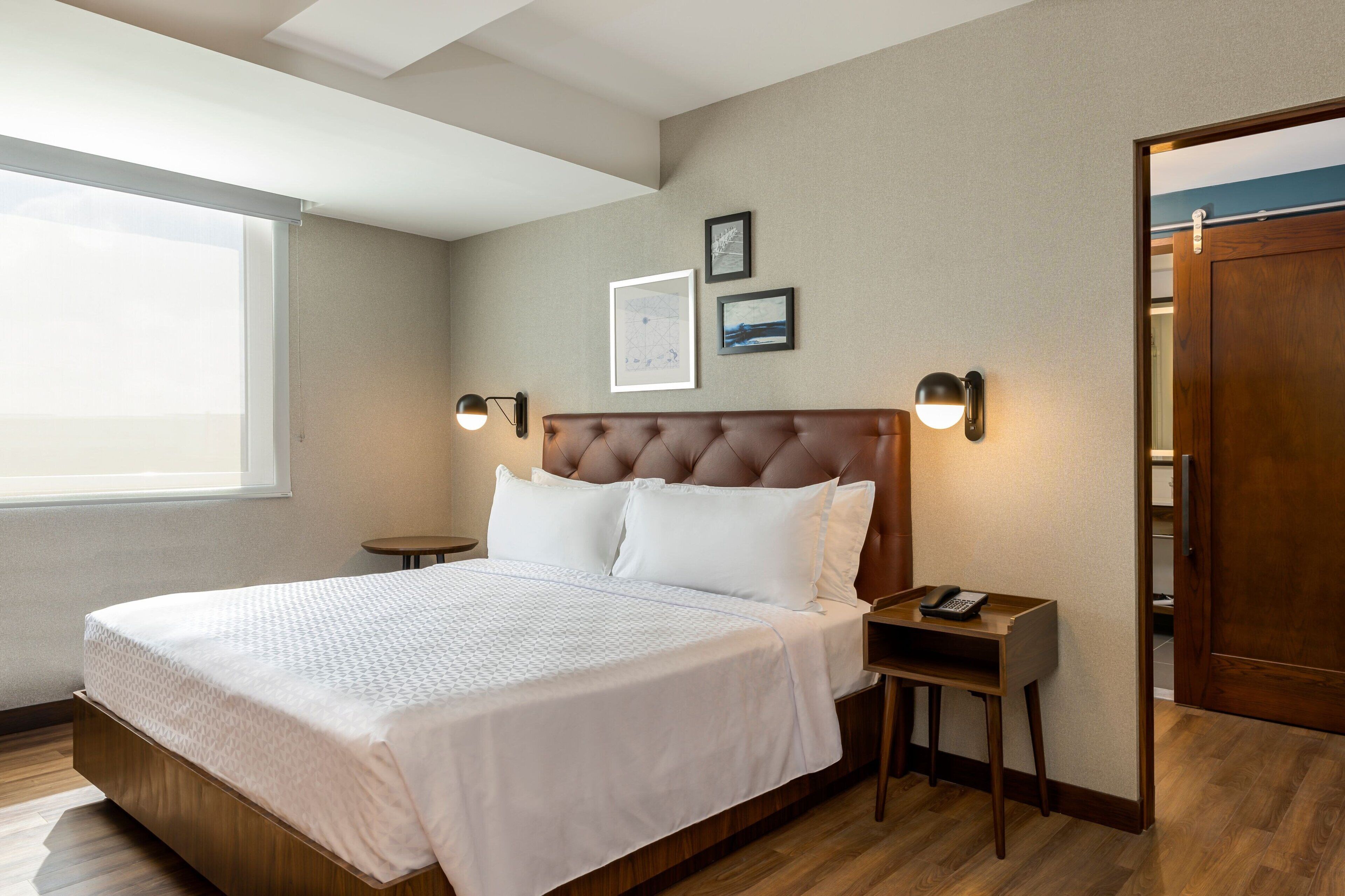 premium room, 1 king bed, non smoking | in-room safe, desk, iron/ironing board, free cots/infant beds