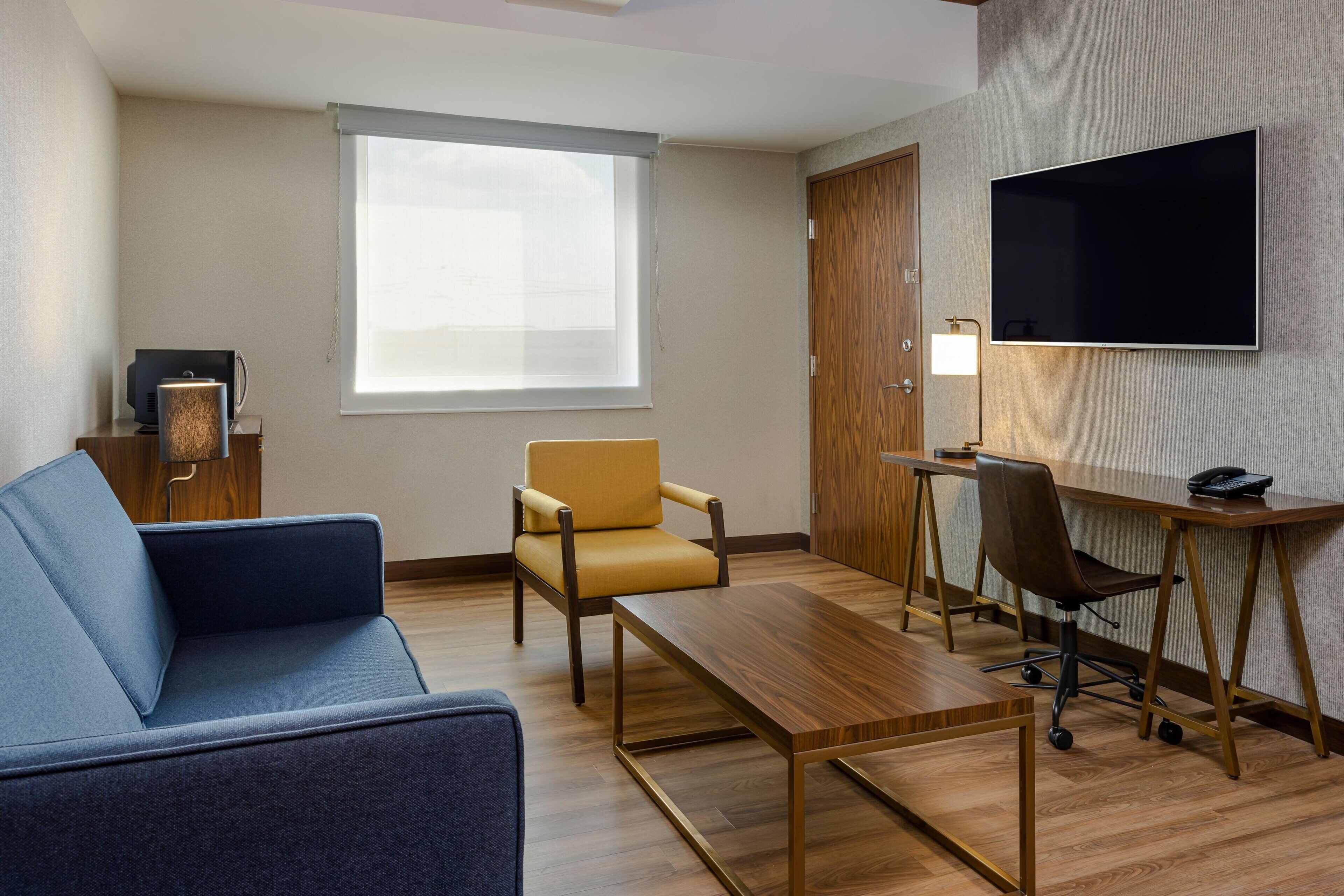 premium suite, 1 king bed with sofa bed, non smoking | in-room safe, desk, iron/ironing board, free cots/infant beds