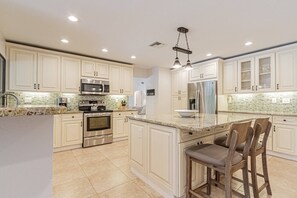 Fridge, dishwasher, coffee/tea maker - Kings Lake: 3 BR home w/3 en suite baths, heated pool & expansive covered lanai w/outdoor TV (Naples)