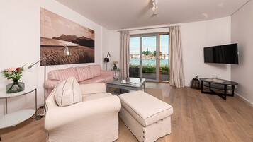 Condo | Living area | 50-inch flat-screen TV with cable channels, TV, fireplace