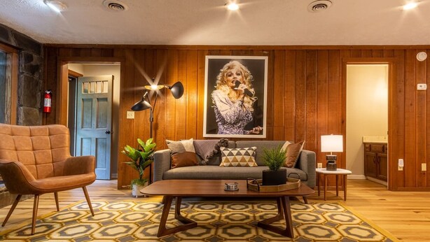 A living room with a sofa, armchair, coffee table, and a patterned rug. - THE DOGWOOD @ DOLLYS DRIVE * Wifi Grill Woods Mtns (Sevierville)