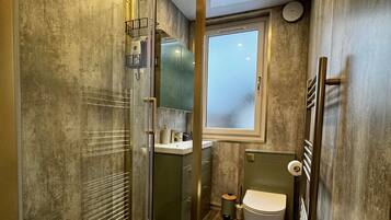 Bathtub, hair dryer, towels, soap