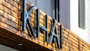 A building with a wooden facade and the name "KHAI" prominently displayed. - Khai Hotel Bodrum (Bodrum)