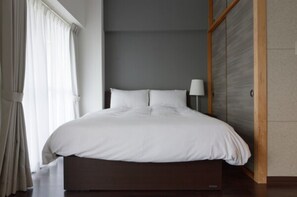 Relax in comfort with a queen-sized bed and ample storage space.