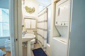 Bathtub, hair dryer, towels