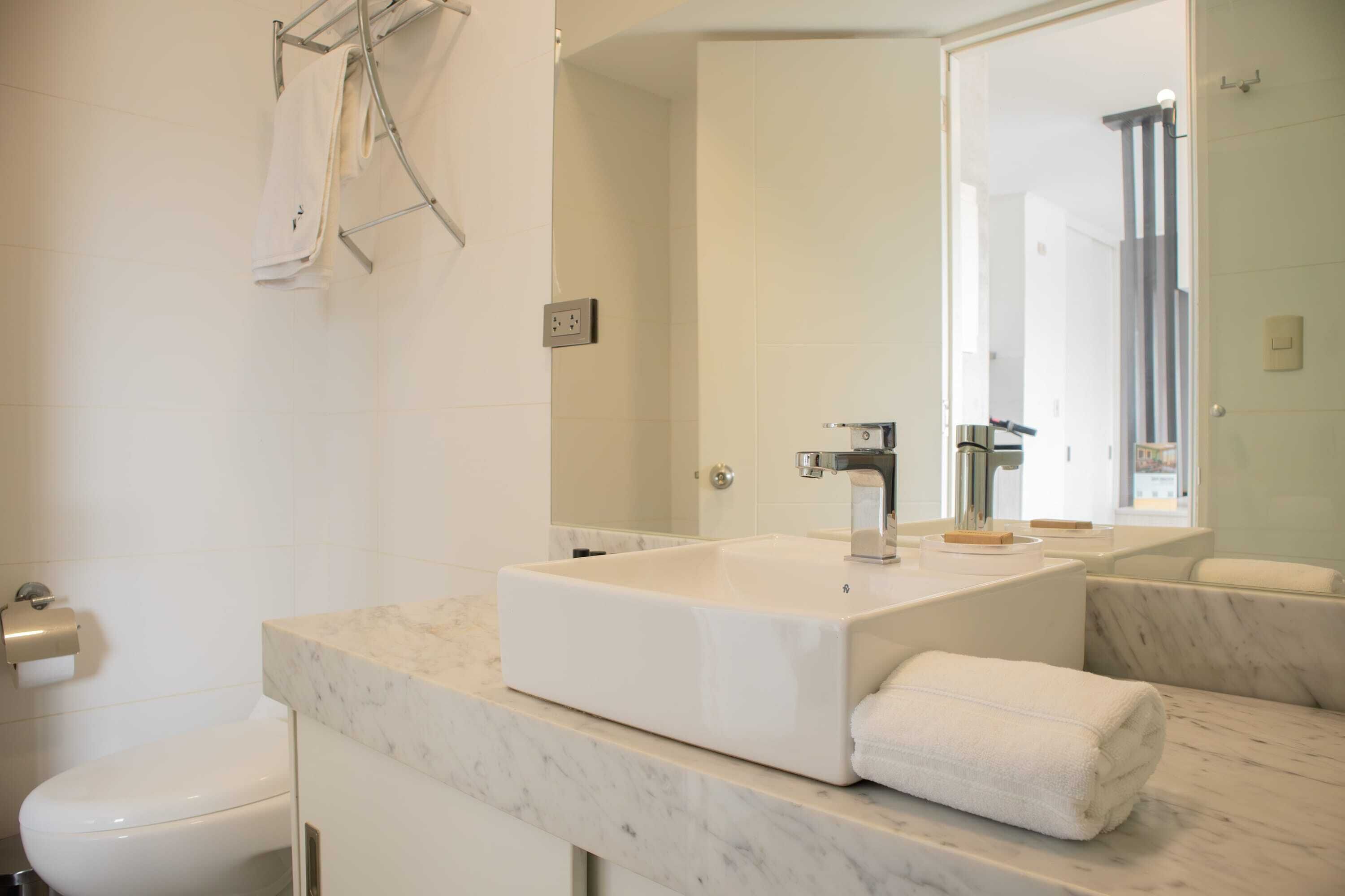 Shower, hair dryer, towels, shampoo