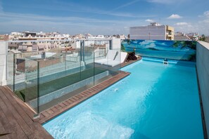 Outdoor pool, a heated pool, sun loungers
