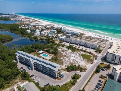 Gulf View - Steps away from beach entrance, heated pool and spa all year long.