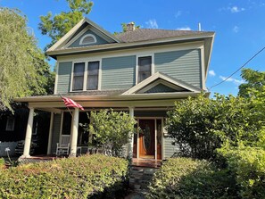 A two-story house with a porch and a front door. - The Nash House | Historic Downtown Ocala 2/2 (Ocala)